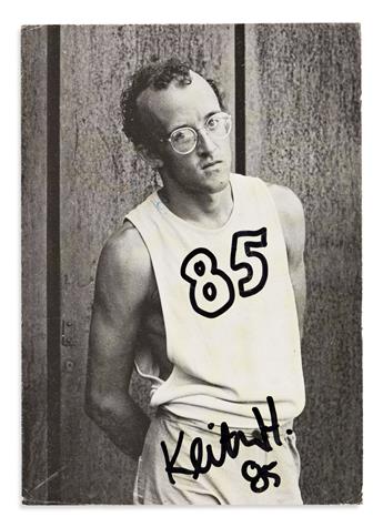 HARING, KEITH. Photograph postcard Signed, with both a small ink drawing and holograph address to Michael Levin on verso,